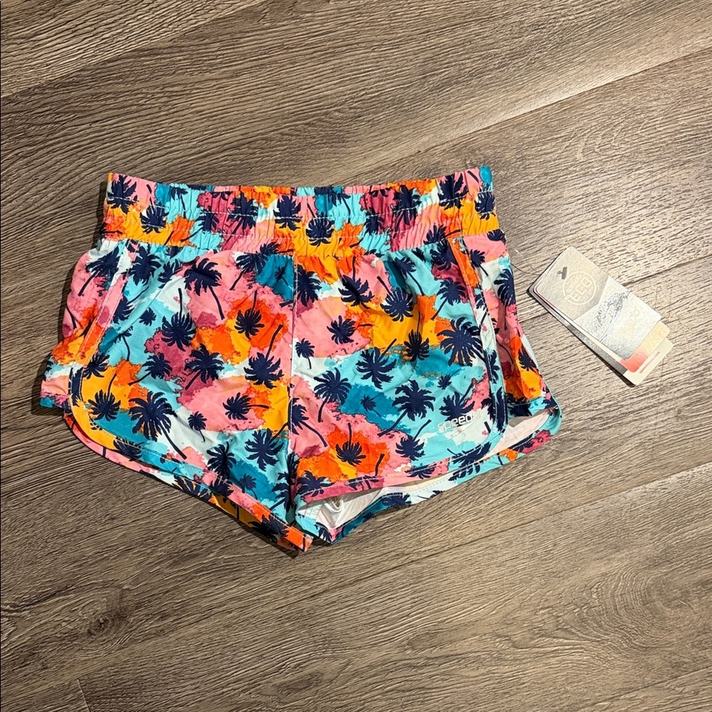 Speedo Girl's Eco Enamel Blue Palm Tree Board Shorts with an elastic waist.